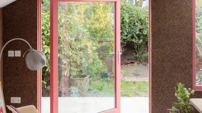 London home with a glass pivot door