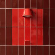 Red UU Tiles by Unknown Untitled with hook and light coming out of them