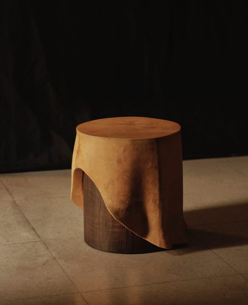Photo of the Duk x Reishi side table, a small circular side table with a top that is sculpted to look like a hanging tablecloth