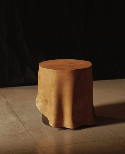 Photo of the Duk x Reishi side table, a small circular side table with a top that is sculpted to look like a hanging tablecloth