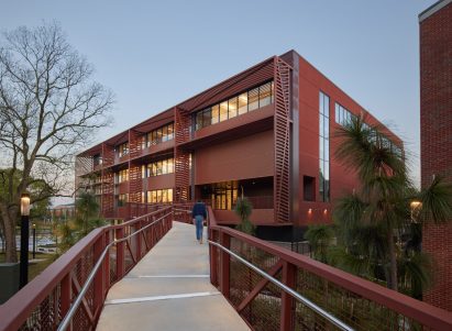 Red building with walkway leading up