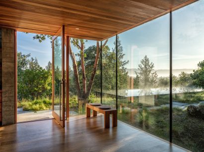 Glass office windows overlooking California woodland