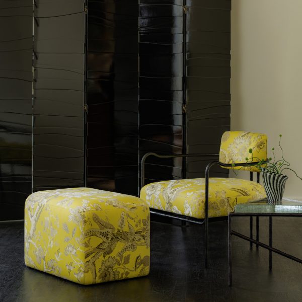 Photo of yellow chair and pouffe