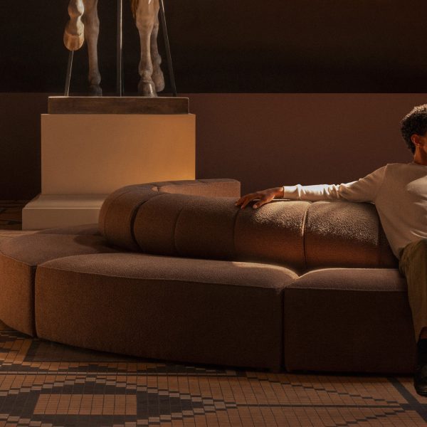 Photo of person sat on a sofa by Audo Copenhagen
