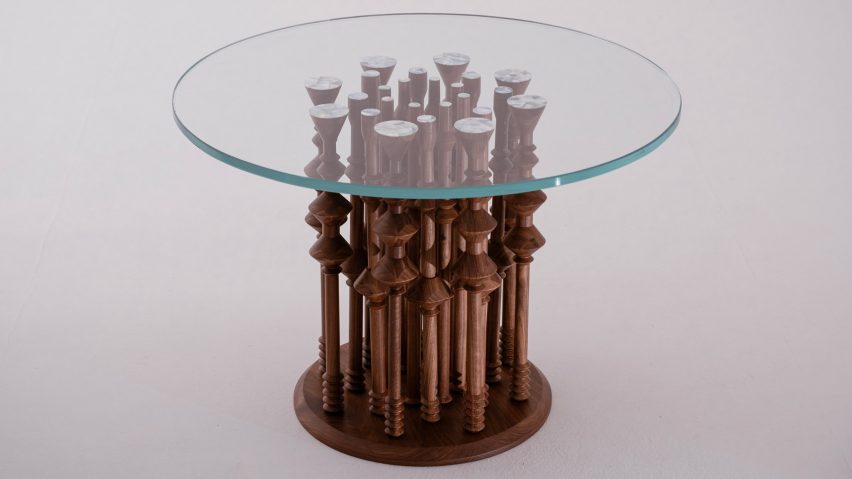 Photo of wooden table with glass top by Xena Kalouti