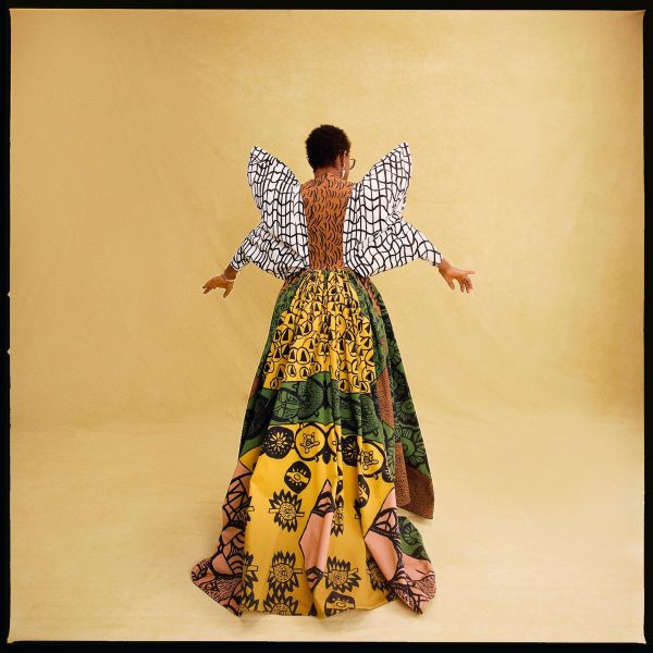Elizabethan-inspired gown with colourful patterns worn by model