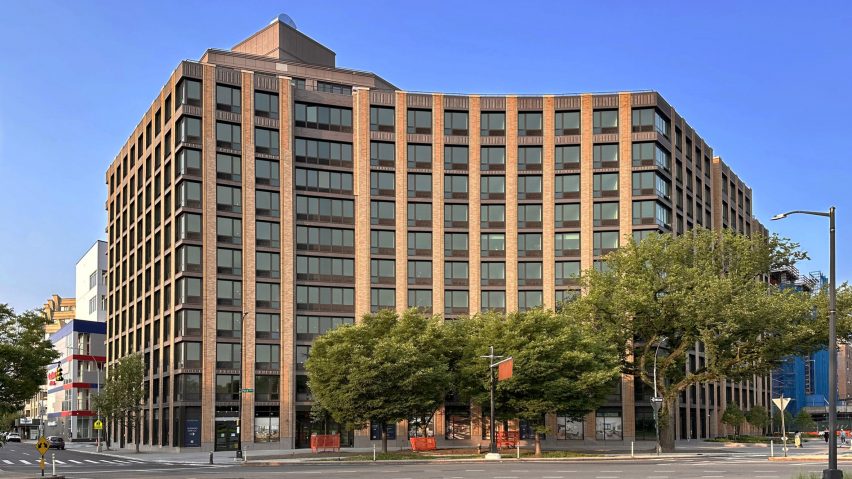 One Park Point building in Brooklyn, New York, featuring sawtooth decorative brickwork by Belden Brick. The curved multi-story structure showcases warm-toned custom brick facade with rhythmic window patterns, surrounded by trees along the street corner