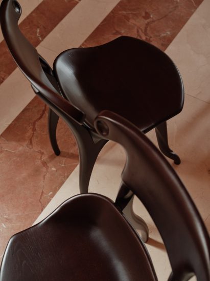 Two dark-toned versions of the Battló Chair