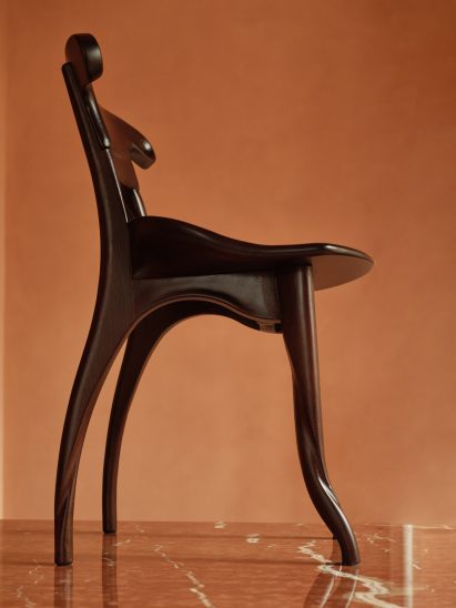 Upshot of dark stained Antoni Gaudi chair