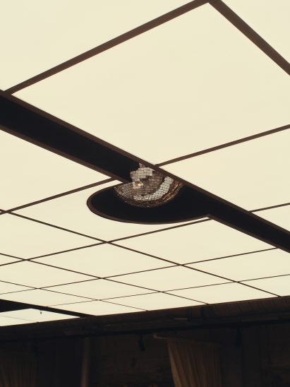 Disco ball coming out of ceiling of restaurant in Brisbane designed by J.AR Office