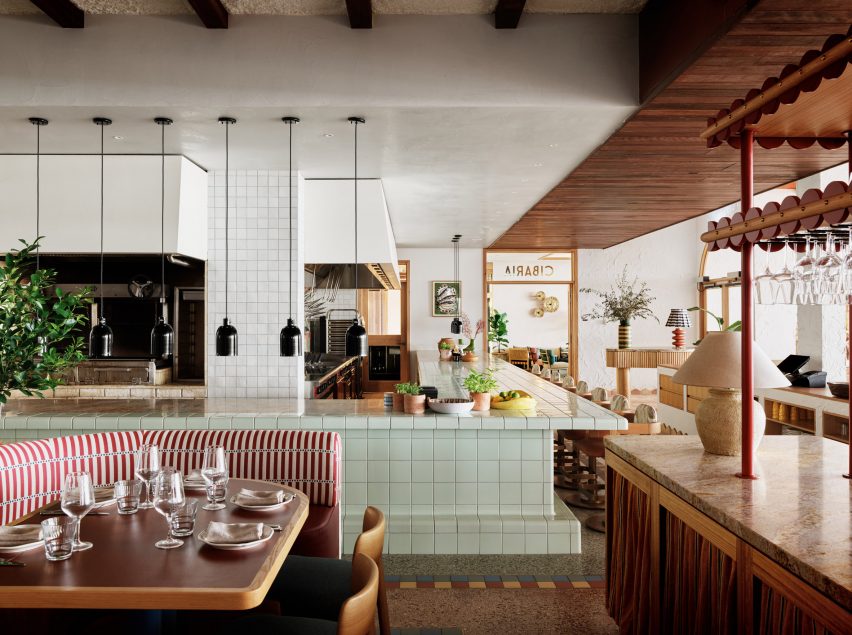 Pistachio green tiled counter and wooden details in Cibaria restaurant