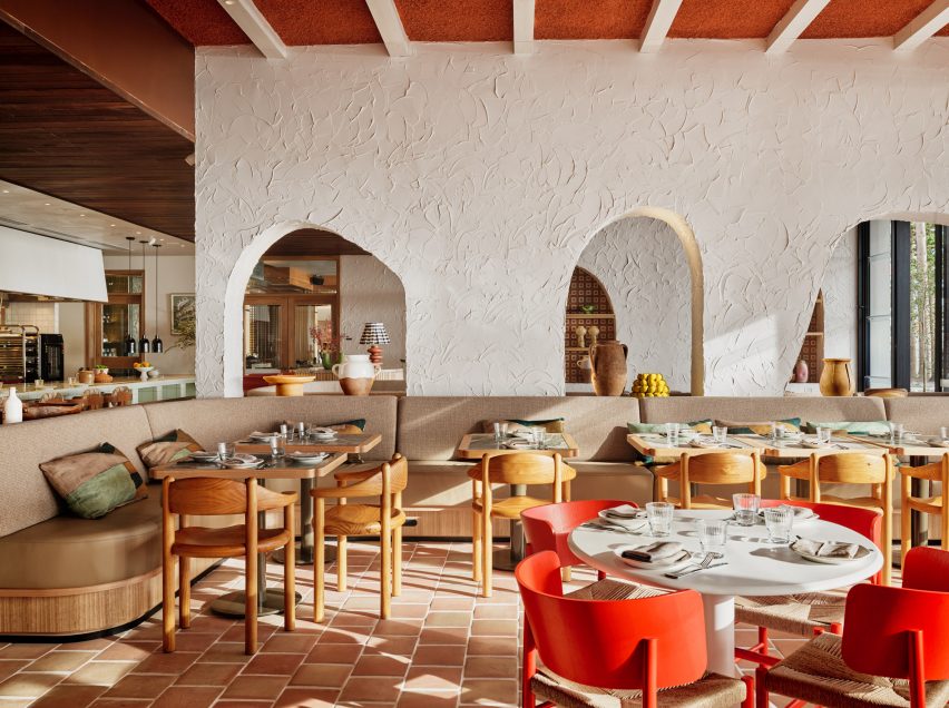 Light flooding into dining space with red chairs Cibaria restaurant