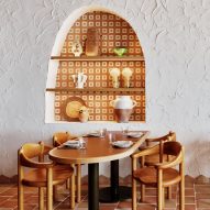 Arched niche and wooden table inside restaurant Sydney