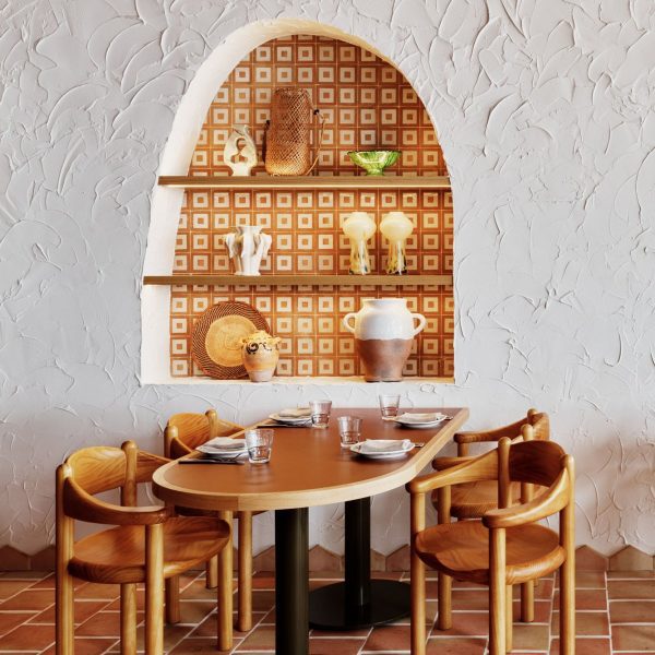 Arched niche and wooden table inside restaurant Sydney