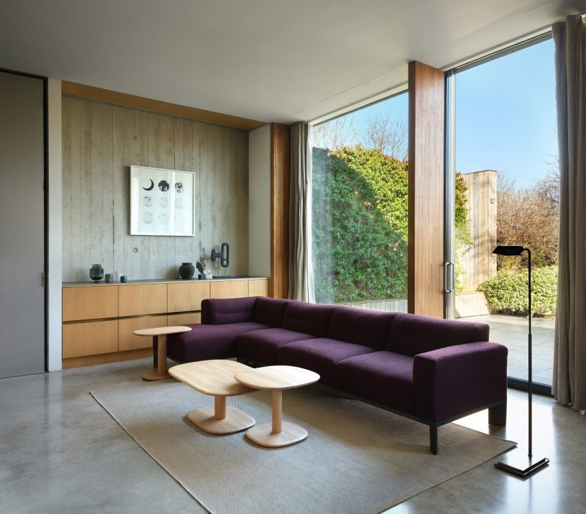 Purple sofa next to window