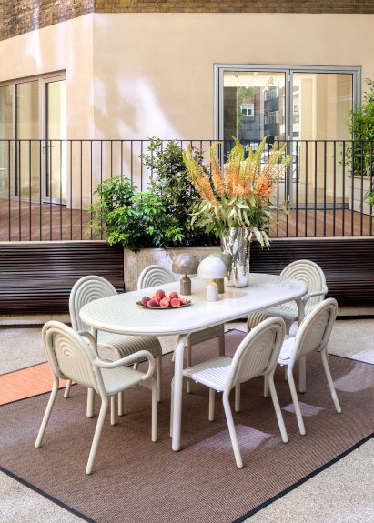 White chairs on outdoor rug