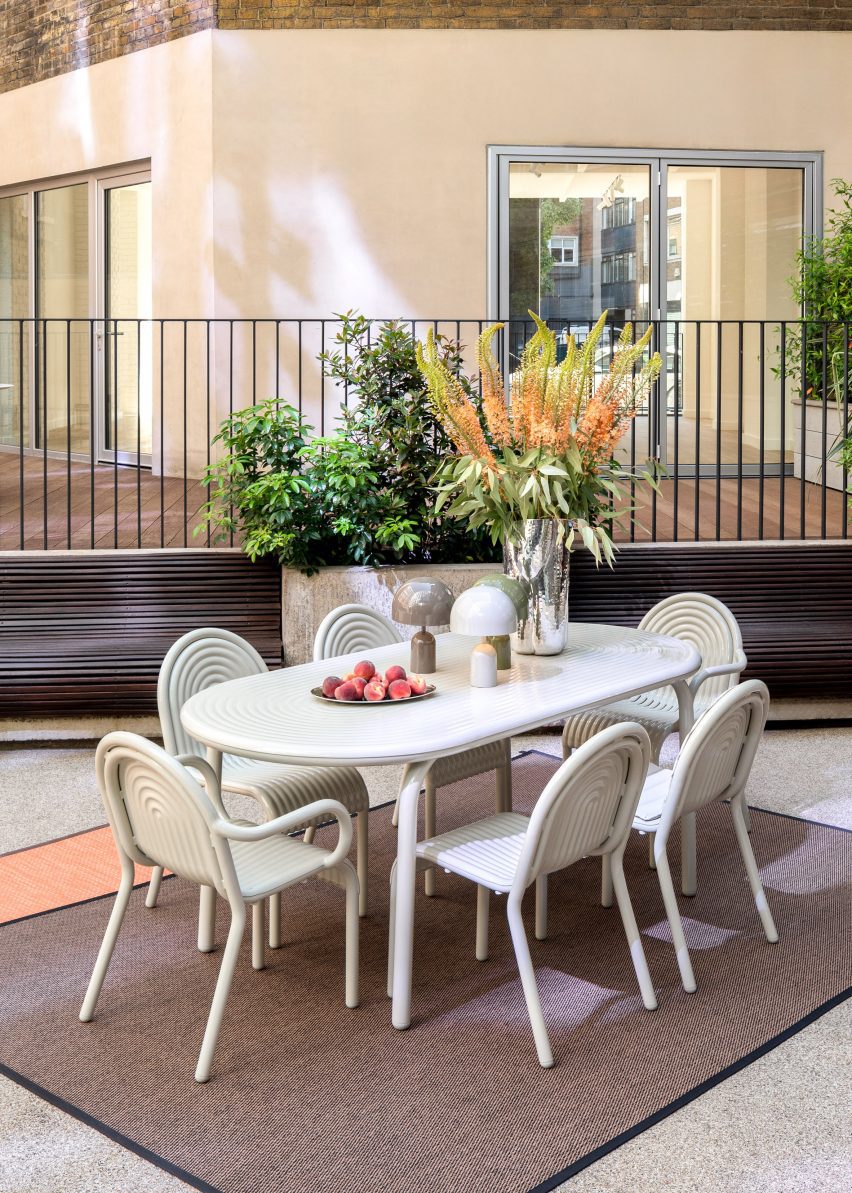 White chairs on outdoor rug