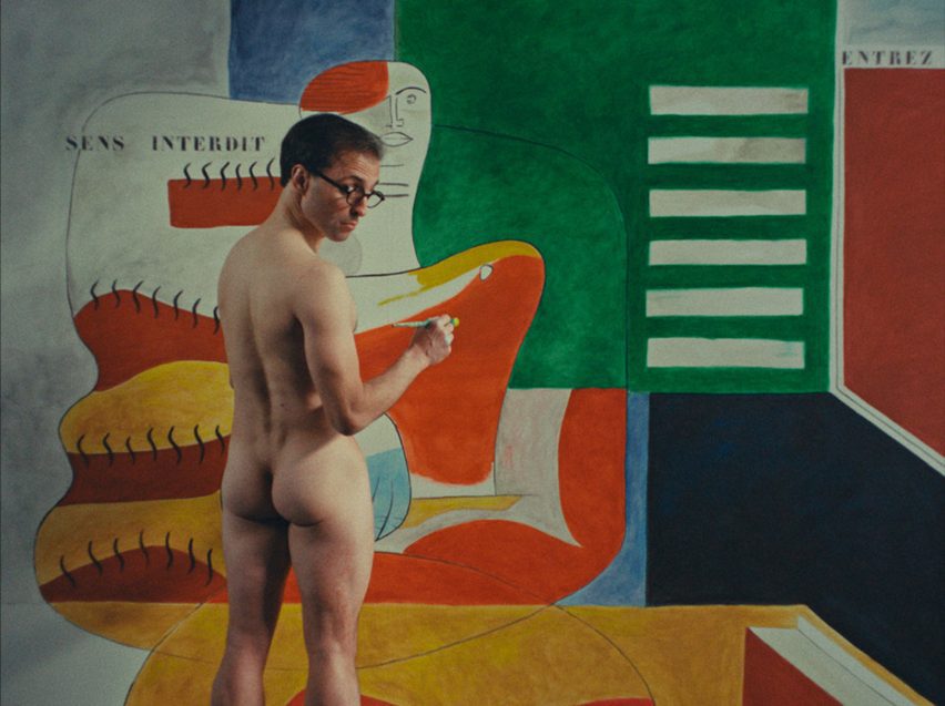 Still from E-1027 - Eileen Gray and the House by the Sea showing Le Corbusier painting the walls