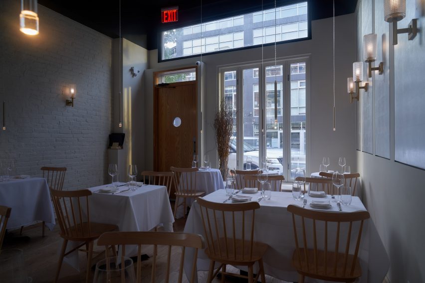 White tables and wooden chairs