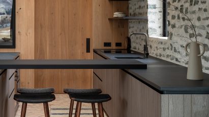 Kitchen interior with custom timber cabinetry and Fisher & Paykel appliances
