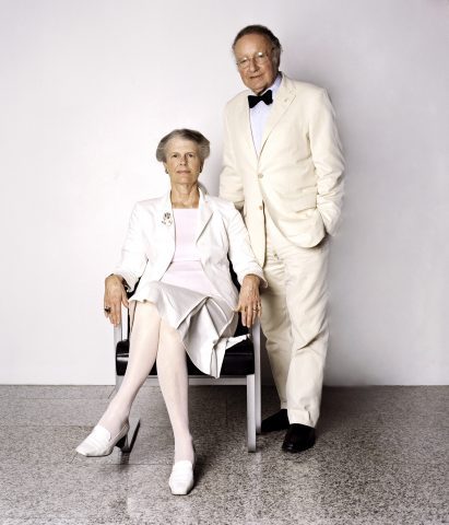 Penelope seated and harry standing behind her pose for a portrait by Petrina Hicks, 2005