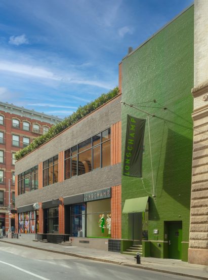Exterior of green Longchamp store in Soho Manhattan