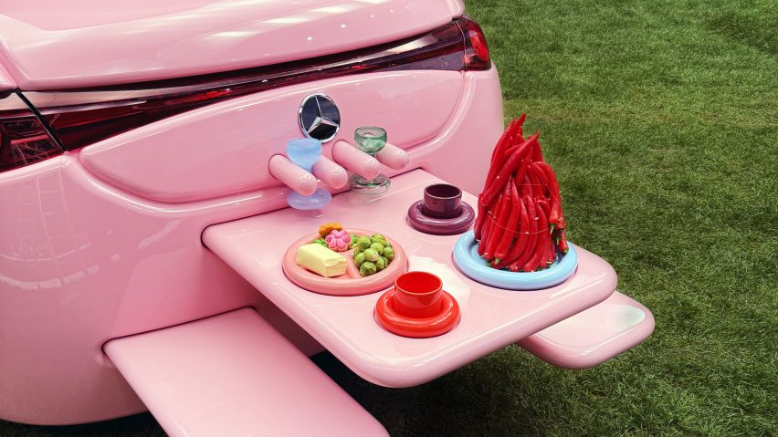 Picnic table coming out of rear of All-pink Mercedes-Benz CLA