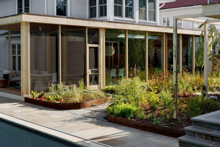 Glass enclosed kitchen underneath historic DC home
