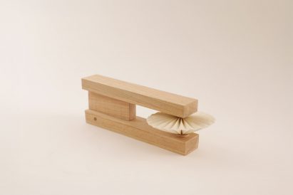 a photograph of a rectangular wooden object that acts as a timer