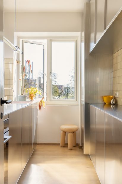 Galley kitchen with stainless steel cabinets on either side