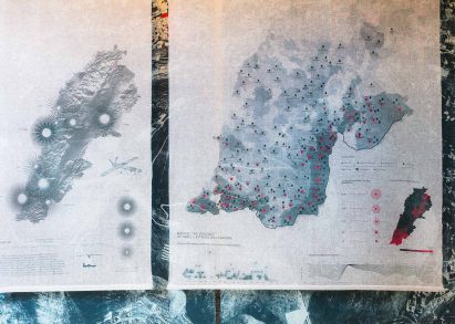 Photo of a map of southern Lebanon printed on textile showing the number of days different areas have been bombed with white phosphorous