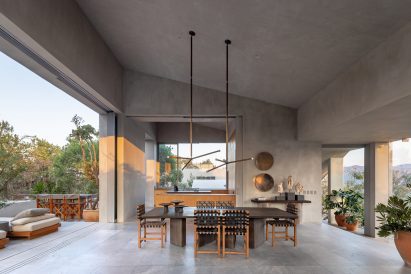Dining room with open sides and light grey stucco walls