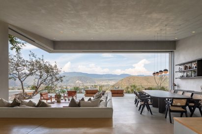 Living and dining room with panoramic mountain views