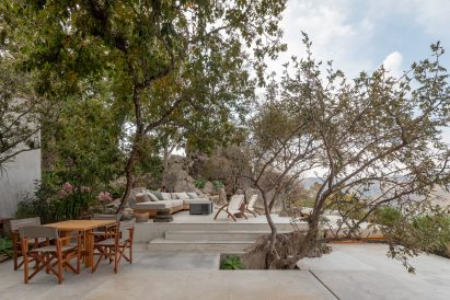 A patio with multiple levels and outdoor furniture