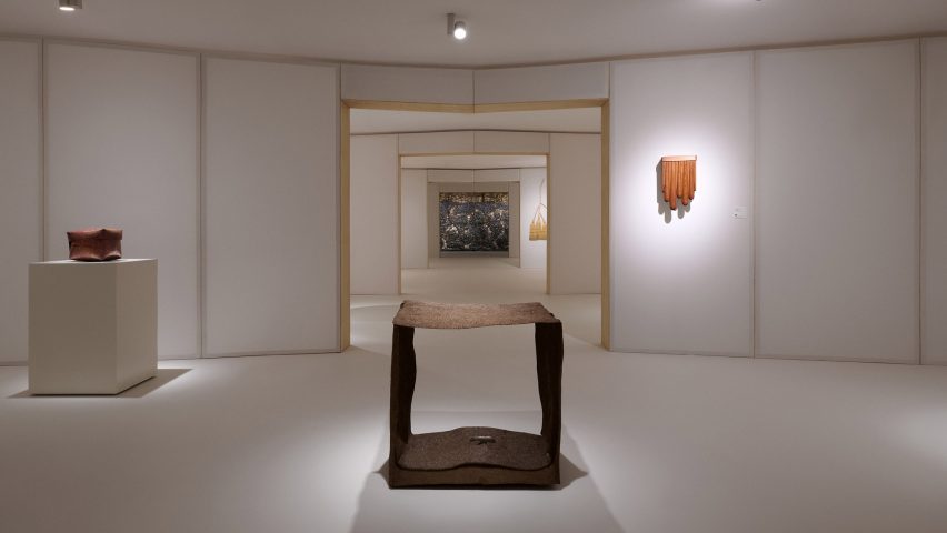 Exhibition space with spotlit exhibits