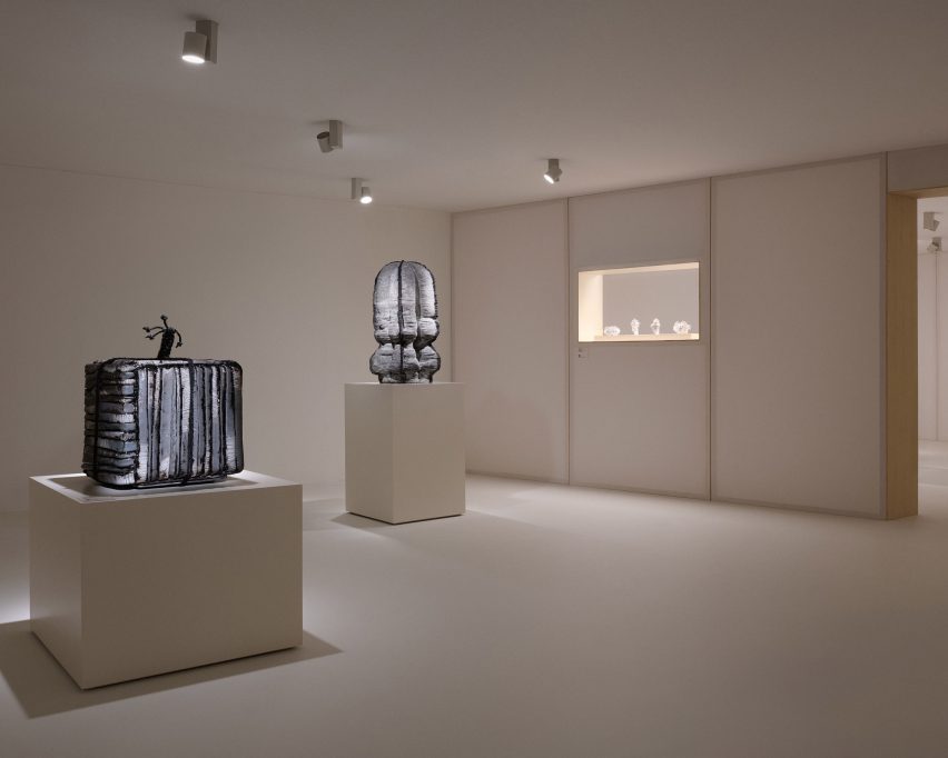 ceramic objects on display plinths in exhibition space