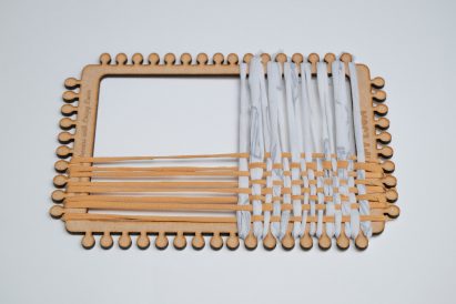 Fabric scraps woven onto a simple rectangular loom