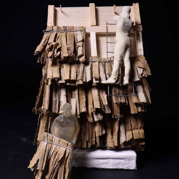 a photograph of an architectural model with a thatched texture