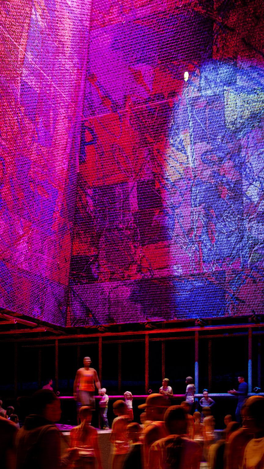 a photograph of a room with walls in tones of purple, pink and blue