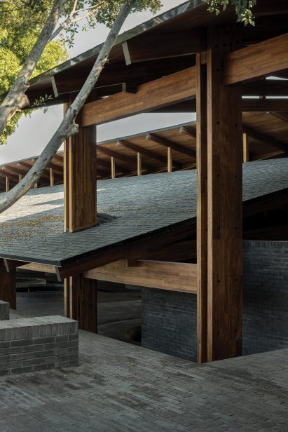 A cross-laminated timber structure supports pitched, overlapping roof planes