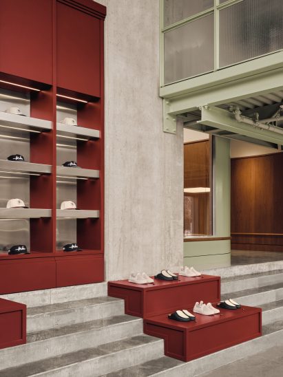 Burgundy millwork provides retail displays a double-height lobby