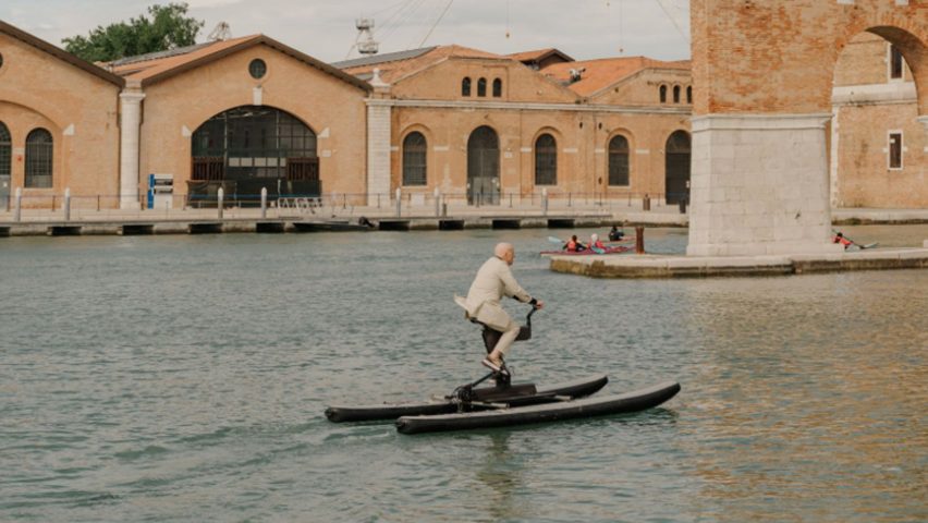 Norman foster riding a water bike