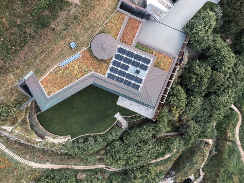 Roof of Two-Family House by Rundell Associates with solar panels