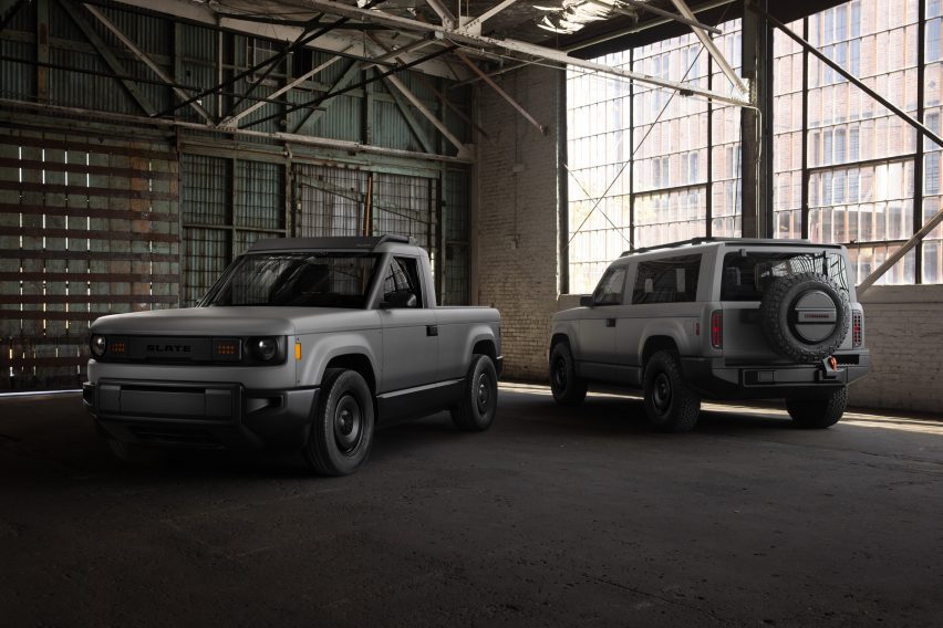 Photo of two Slate Trucks parked in a hanger