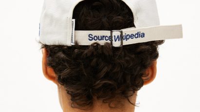 Back of cap reading "Source: Wikipedia" from streetwear collection by Wikimedia Foundation and Armedangels