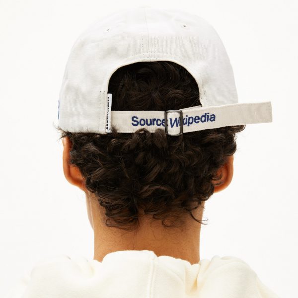 Back of cap reading "Source: Wikipedia" from streetwear collection by Wikimedia Foundation and Armedangels