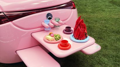 Picnic table coming out of rear of All-pink Mercedes-Benz CLA by Gustaf Westman