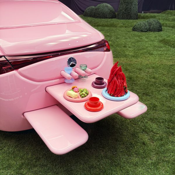 Picnic table coming out of rear of All-pink Mercedes-Benz CLA by Gustaf Westman
