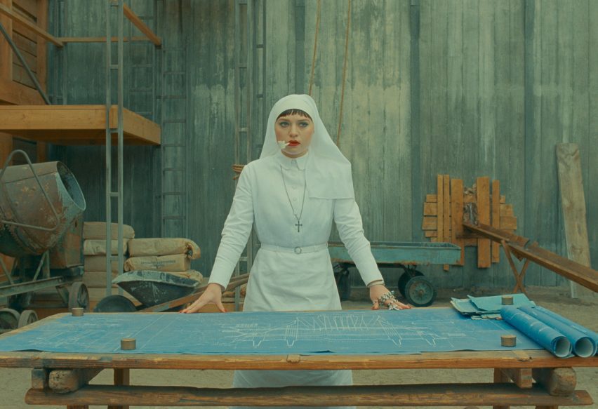 Sister Liesl standing over blueprint