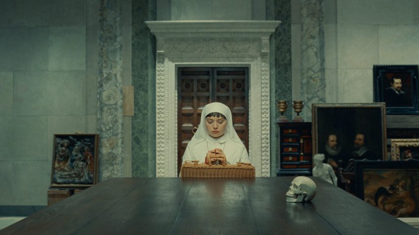 Woman praying at stone table